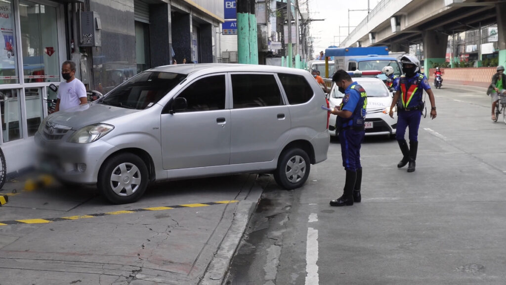 a man standing next to a car