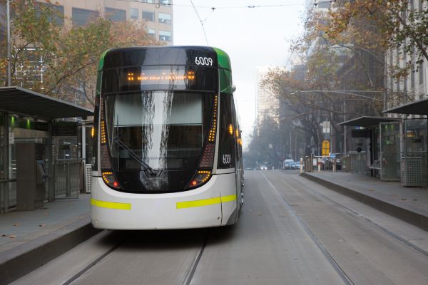 Melbourne tram about to travel down Collins Street on a winter morning
