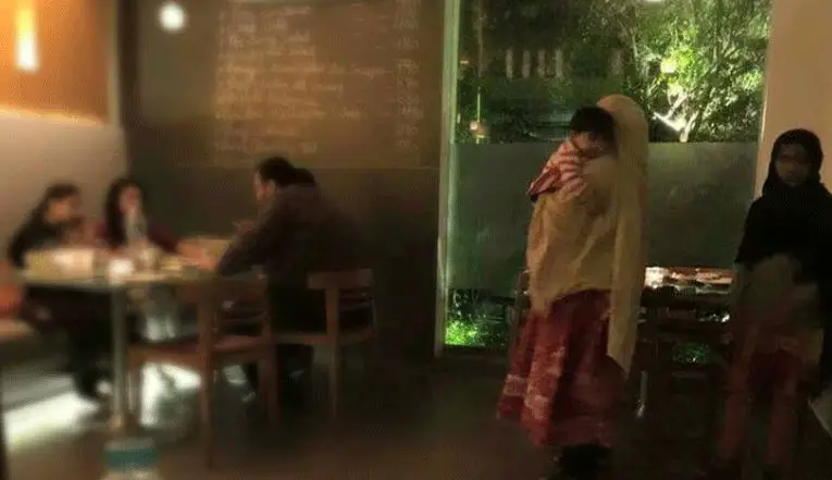 Hungry Helpers While Employers Enjoy Their Meals